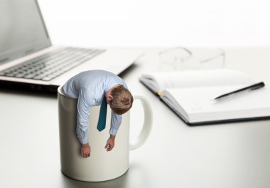 Tired man in white cup clipart