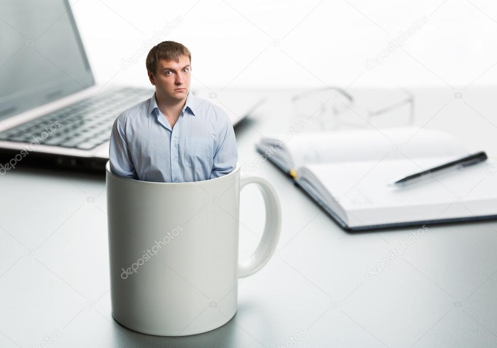 Astonished man in cup