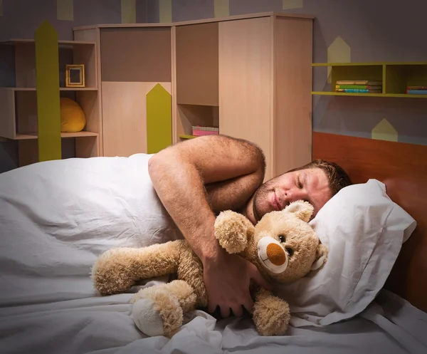 Man in bed — Stockfoto
