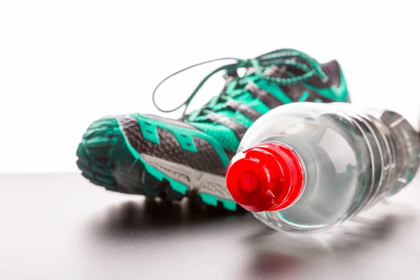 Sport schoen en water fles — Stockfoto