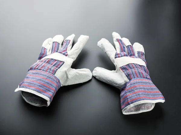 Work glove against grey — Stock Photo, Image