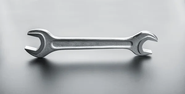 Industrial spanner on dark — Stock Photo, Image