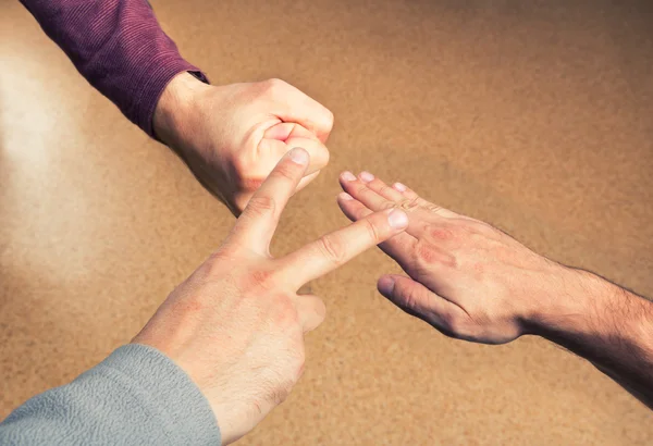 Hands playing paper rock scissors — Stock Photo, Image