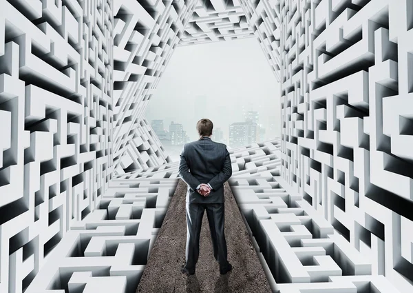 Businessman in labyrinth — Stock Photo, Image