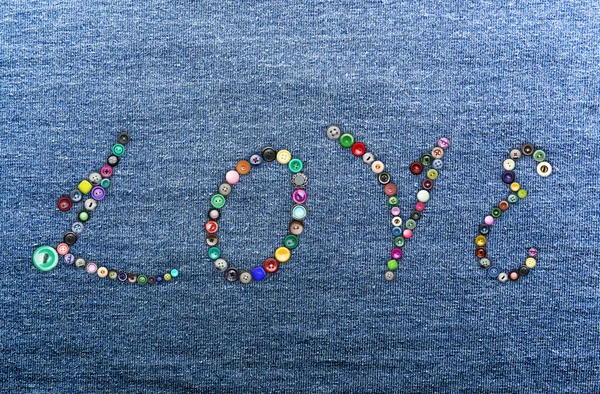 Colorful buttons forming the word 'love' — Zdjęcie stockowe