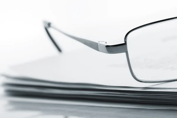 Glasses on newspaper — Stock Photo, Image