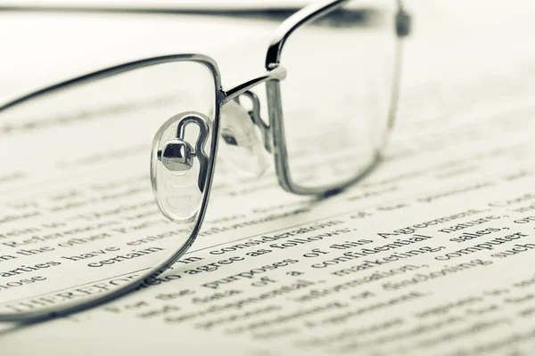 Glasses on newspaper. Toned — Stock Photo, Image