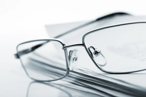 Glasses on newspaper. Toned image — Stock Photo, Image