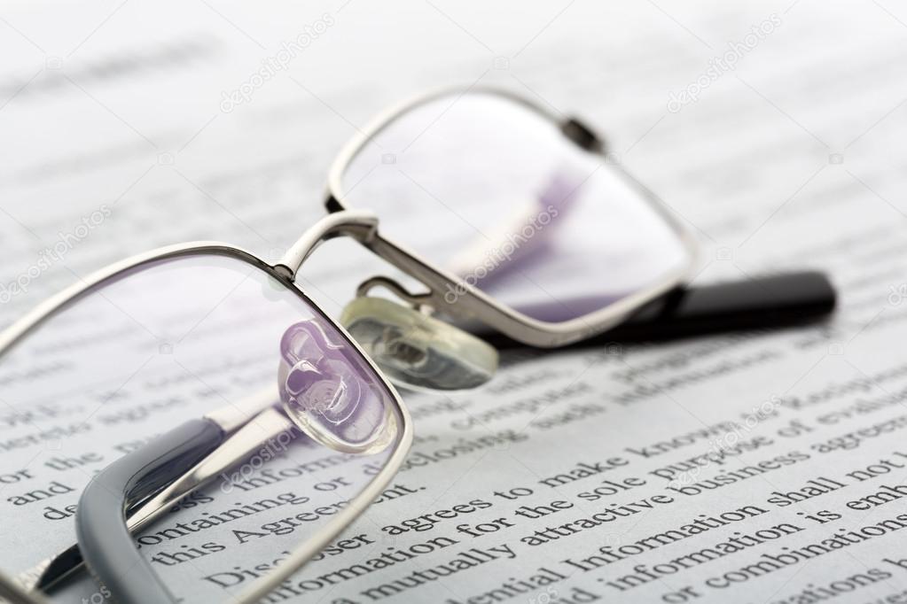 Glasses lies on the newspaper