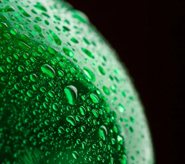 Green wet plastic water bottle — Stock Photo, Image