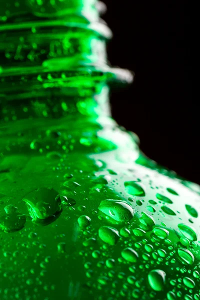 Green wet plastic water bottle — Stock Photo, Image