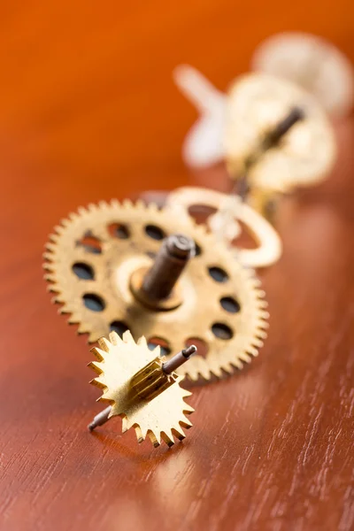 Gears on wooden table — Stock Photo, Image