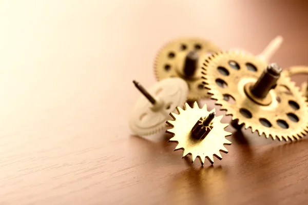 Gears on wooden table — Stock Photo, Image