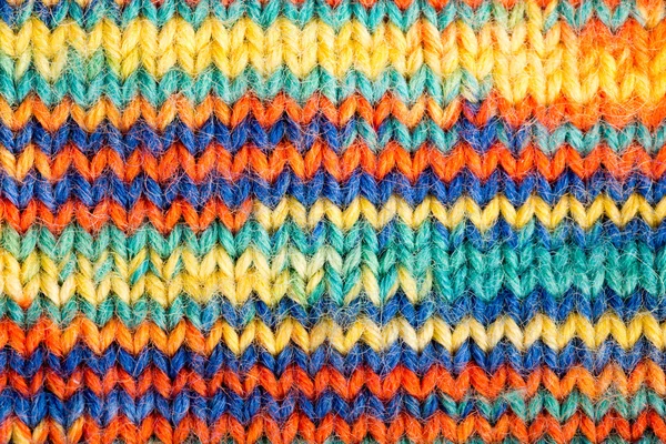 Knitted multicolored scarf in closeup — Stock Photo, Image