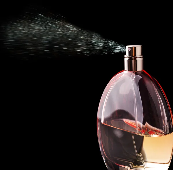 Bottle of perfume spraying — Stock Photo, Image