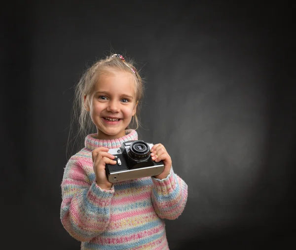 Little girl with retro camera — Stock Photo, Image