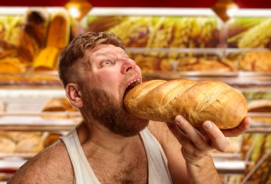Man eating bread in the shop clipart