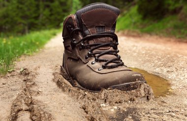 Tracking boot in a dirt clipart