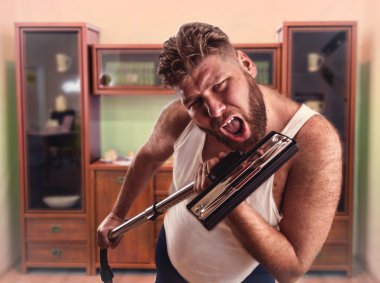 Man with beard sings to the vacuum cleaner clipart