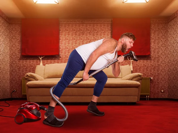 Adult man sings to the vacuum cleaner — Stock Photo, Image