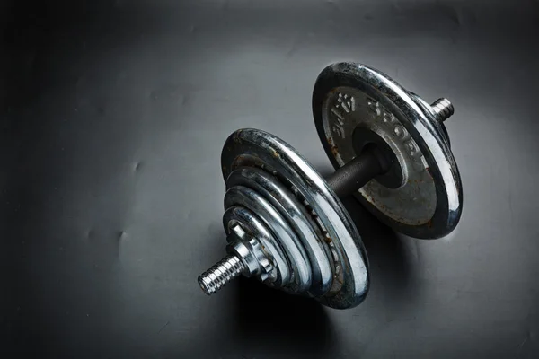 Old steel dumbbell — Stock Photo, Image