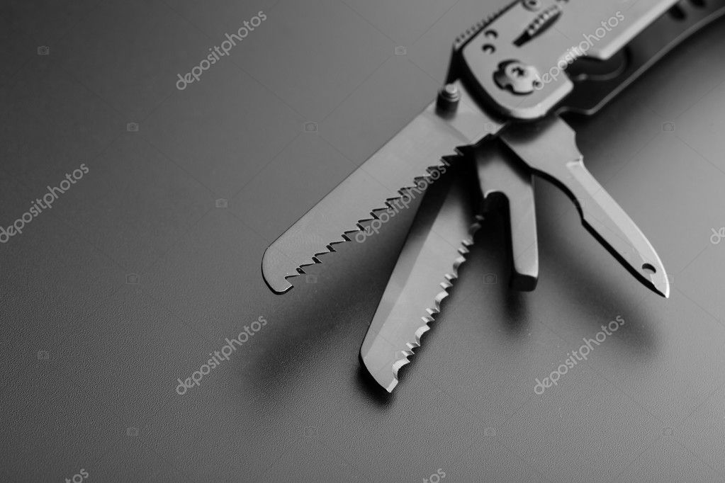 Opened multitool knife Stock Photo by ©Nomadsoul1 69590687