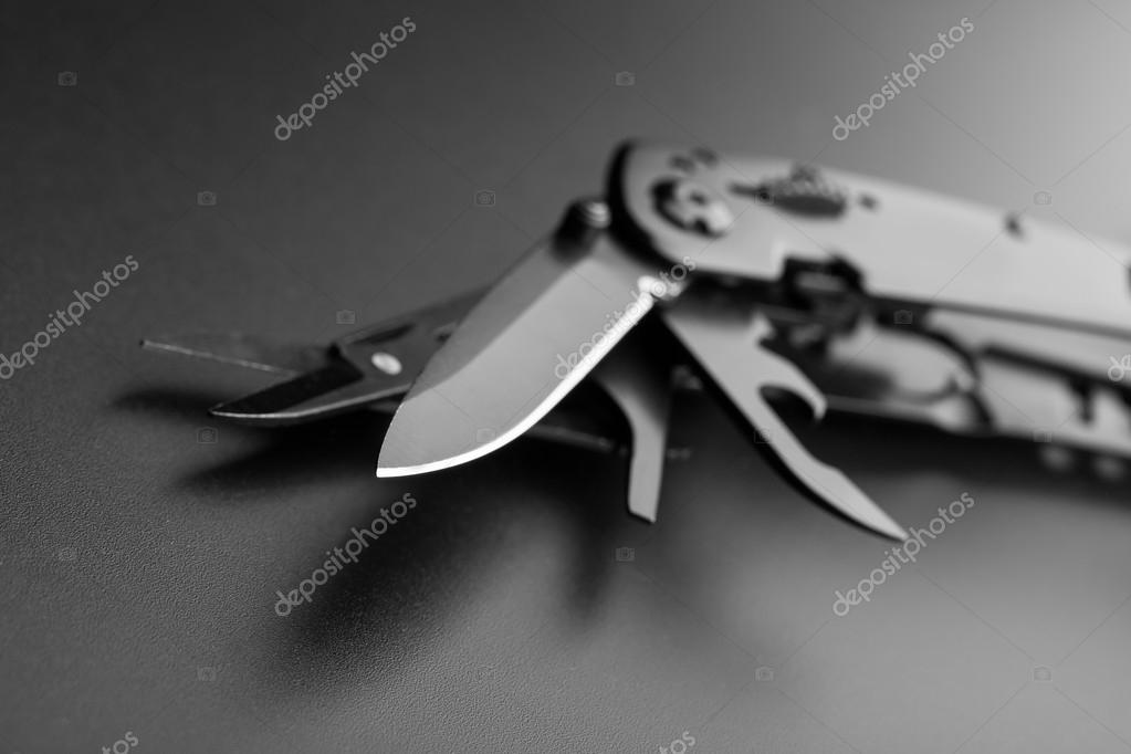 Opened multitool knife Stock Photo by ©Nomadsoul1 69590713