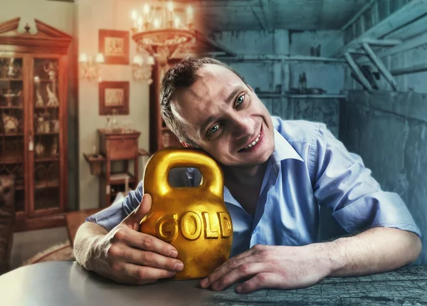 Happy man with gold kettlebell — Stock Photo, Image