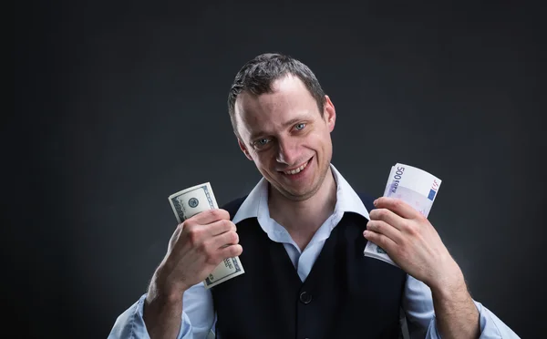 Cheerful businessman holds money — Stock Photo, Image