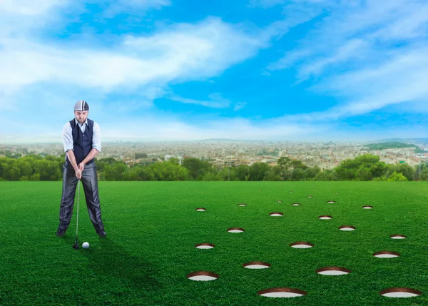 Businessman playing golf — Stock Photo, Image