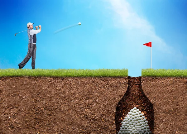 Businessman is hitting the golf ball — Stock Photo, Image