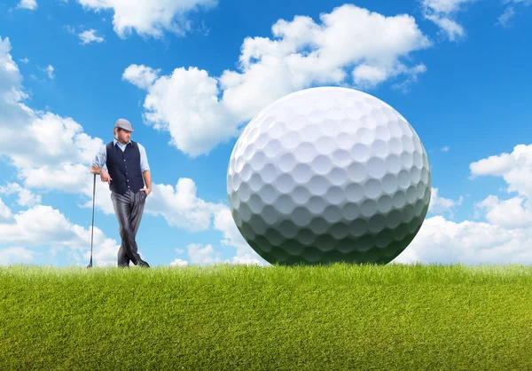 Confident businessman with golf ball — Stock Photo, Image