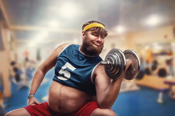 Fat man with dumbbell — Stock Photo, Image