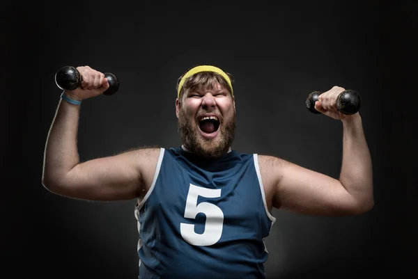 Happy man with dumbbells — Stock Photo, Image