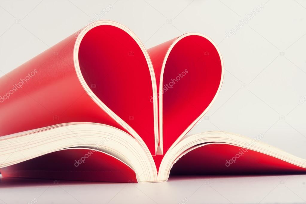 heart shaped sign with book pages