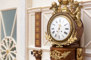Vintage clock with little statues