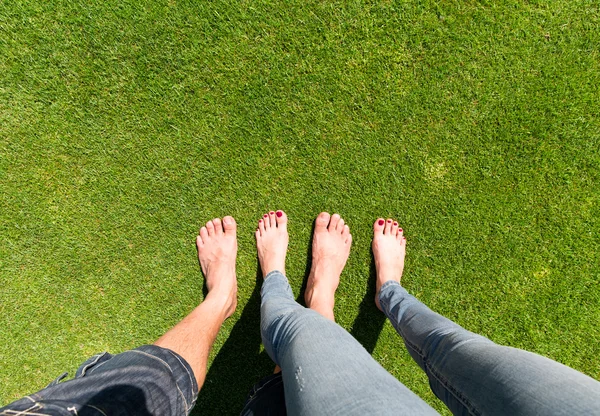 bare feet standing on the grass