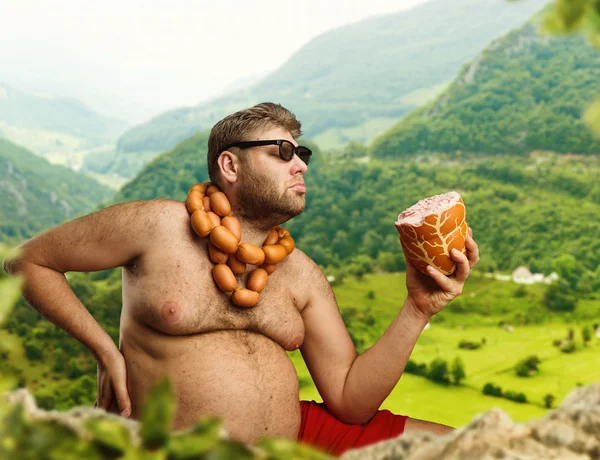 Hombre gordo con salchichas —  Fotos de Stock