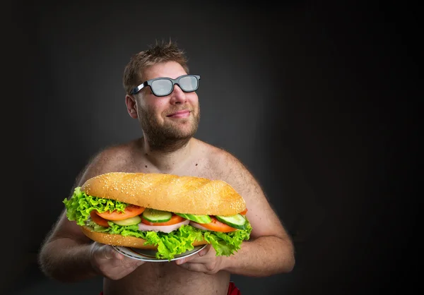 Жирний чоловік з бутербродом — стокове фото