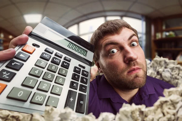 Man holding calculator — Stock Photo, Image