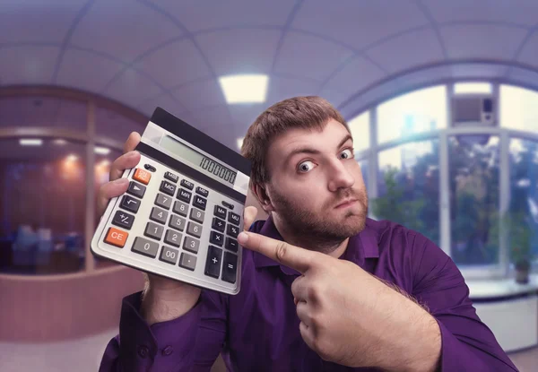 Homem segurando calculadora — Fotografia de Stock