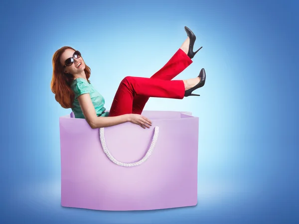 Woman in shopping bag — Stock Photo, Image