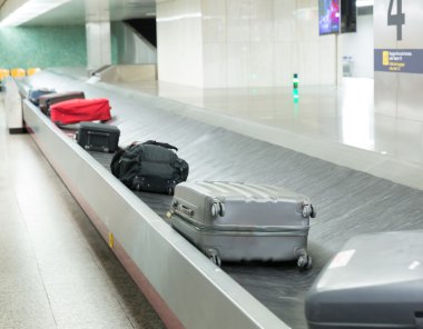 Luggages on airport belt clipart