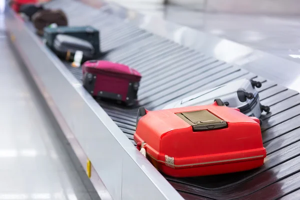 Luggages on airport belt — Stock Photo, Image