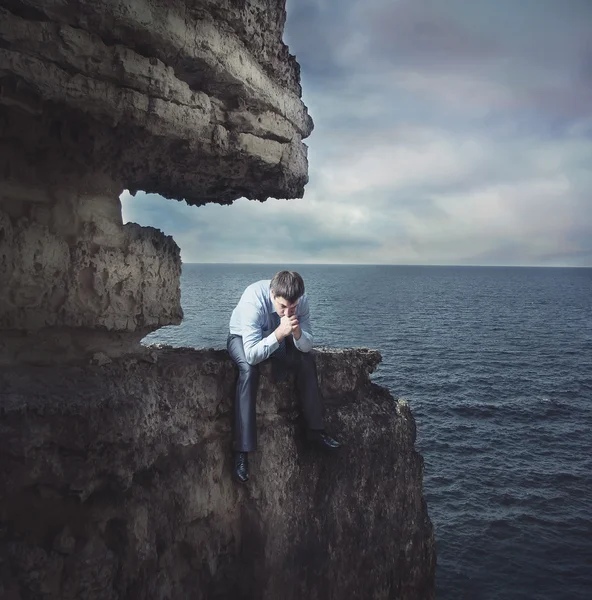 Frustrated businessman on the cliff — Stock Photo, Image