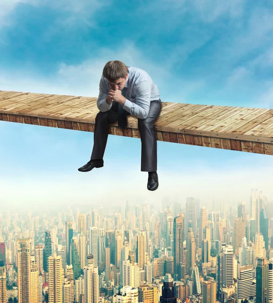 Frustrated businessman above the city — Stock Photo, Image