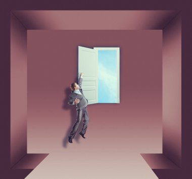 İşadamı açık üzerinde asılı