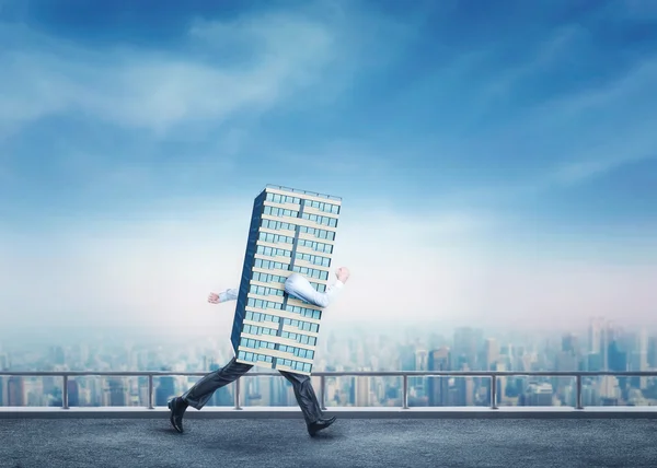 Businessman Skyscraper over city — Stock Photo, Image