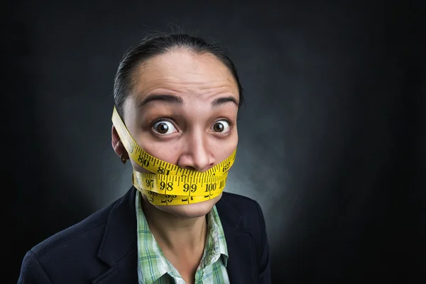 Businesswoman with measuring tape — Stock Photo, Image