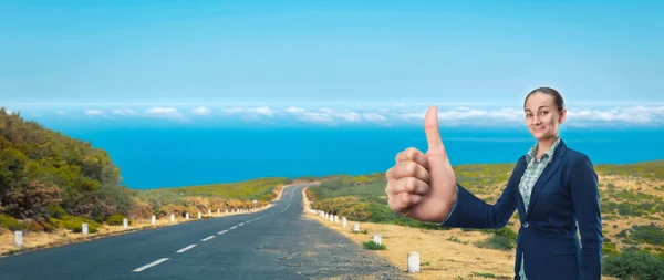 Businesswoman hitching a ride — Stock Photo, Image